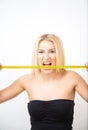 Girl measures her hips. Royalty Free Stock Photo