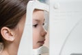 cute girl measuring eyesight Royalty Free Stock Photo