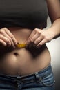 Girl measuring waist measuring tape. Diet results. teenager in j Royalty Free Stock Photo