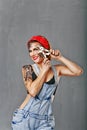 Girl mechanical posing with hand vise.