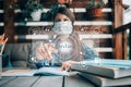 Girl in a medical mask goes to school. she connects online. new rules for schoolchildren in a pandemic Royalty Free Stock Photo