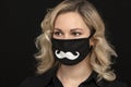 Girl in a medical mask with a mustache pattern, handmade for a masquerade