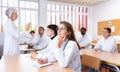 Girl medical student listening to lecture in classroom Royalty Free Stock Photo