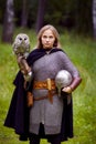 Girl in medieval armor, holding an owl