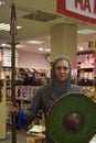 Girl in medieval dress in a modern store
