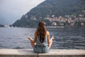 Girl meditating by the lake Royalty Free Stock Photo