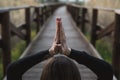 Girl meditating and practicing yoga in nature. Concept of wellness and relaxation Royalty Free Stock Photo