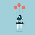 A girl sitting on a chair doing meditation and levitated by the balloons attached to it Royalty Free Stock Photo