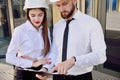 A girl with a man in construction white helmets and white shirts Royalty Free Stock Photo