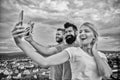 Girl and man with mobile smartphones communication online. Selfie time. Life online. People taking selfie or streaming Royalty Free Stock Photo