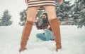 girl and man snowball fight in snowy forest. Christmas couple of happy man and woman. Couple in love in winter Royalty Free Stock Photo