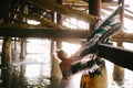 Girl with mexican blanket under pier Royalty Free Stock Photo