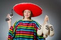 Girl in mexican poncho holding handgun and money Royalty Free Stock Photo