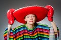 The girl in mexican vivid poncho and box gloves Royalty Free Stock Photo