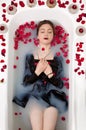 Girl milk water bath red roses candles Royalty Free Stock Photo