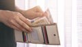 Girl with milky brown wallet full of money Royalty Free Stock Photo