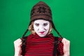 Girl mime posing and grimacing in photo studio Royalty Free Stock Photo