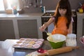 Girl mixing batter in bowl