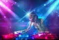 girl mixing music with powerful light effects Royalty Free Stock Photo