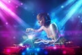 girl mixing music with powerful light effects Royalty Free Stock Photo