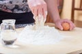 Girl is mixing the water and flour Royalty Free Stock Photo