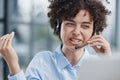 girl in a modern office working in a call center smiling Royalty Free Stock Photo