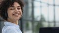 girl in a modern office working in a call center smiling Royalty Free Stock Photo