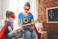 Girl and mom in Superhero costume Royalty Free Stock Photo