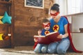 Girl and mom in Superhero costume Royalty Free Stock Photo