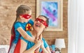 Girl and mom in Superhero costume Royalty Free Stock Photo