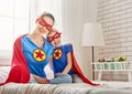 Girl and mom in Superhero costumes Royalty Free Stock Photo