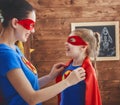 Girl and mom in Superhero costumes Royalty Free Stock Photo