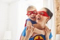 Girl and mom in Superhero costumes Royalty Free Stock Photo