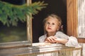 Girl in the morning drinks coffee and looks out the window Royalty Free Stock Photo