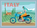 A girl on a motorcycle rides on the background of a rural Italian landscape