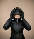 Girl motorcyclist in a black jacket and a helmet