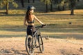 Girl on a mountain bike on offroad, beautiful portrait of a cyclist at sunset Royalty Free Stock Photo