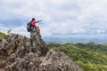 Girl on the mountain Gaze at the beautiful valley in the mist  in the summer. Landscape with sporty young women, hiking, travel Royalty Free Stock Photo