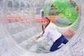 Girl moves inside the zorb Royalty Free Stock Photo