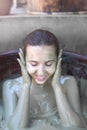 The girl in the mud bath. Concept of relaxation. Nha Trang, Vietnam.