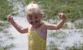 Girl in muddy water Royalty Free Stock Photo