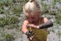 Girl in muddy water Royalty Free Stock Photo