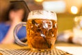 Girl with a mug of beer in a restaurant Royalty Free Stock Photo