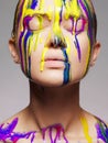 Girl in Multicolor Paint. Colors of woman