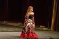 A girl in a national dress dances a gypsy dance Royalty Free Stock Photo