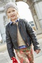 Girl near Arc de Triomphe in Paris, France going forward