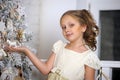 Girl near the Christmas tree Royalty Free Stock Photo