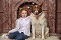 Girl with dog near the fireplace Royalty Free Stock Photo