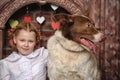 Girl with dog near the fireplace Royalty Free Stock Photo