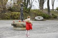 Girl near the monument to the victims of the Holodomor who died of starvation in 1932-33. Kyiv, Ukraine,